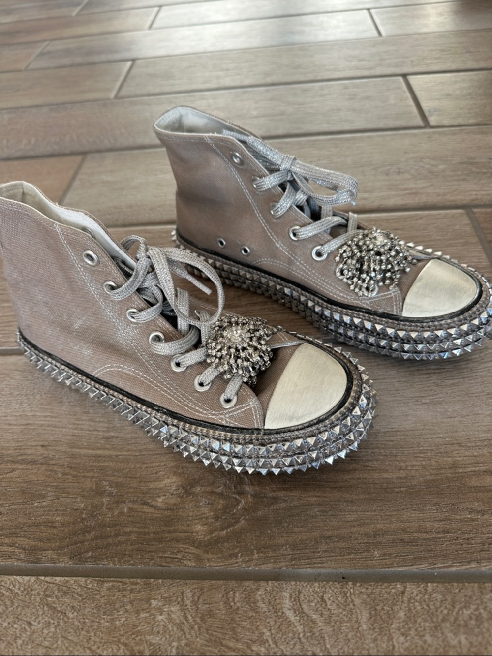 Nan-Ku couture Taupe Embellished High-Top Sneakers from Free People.